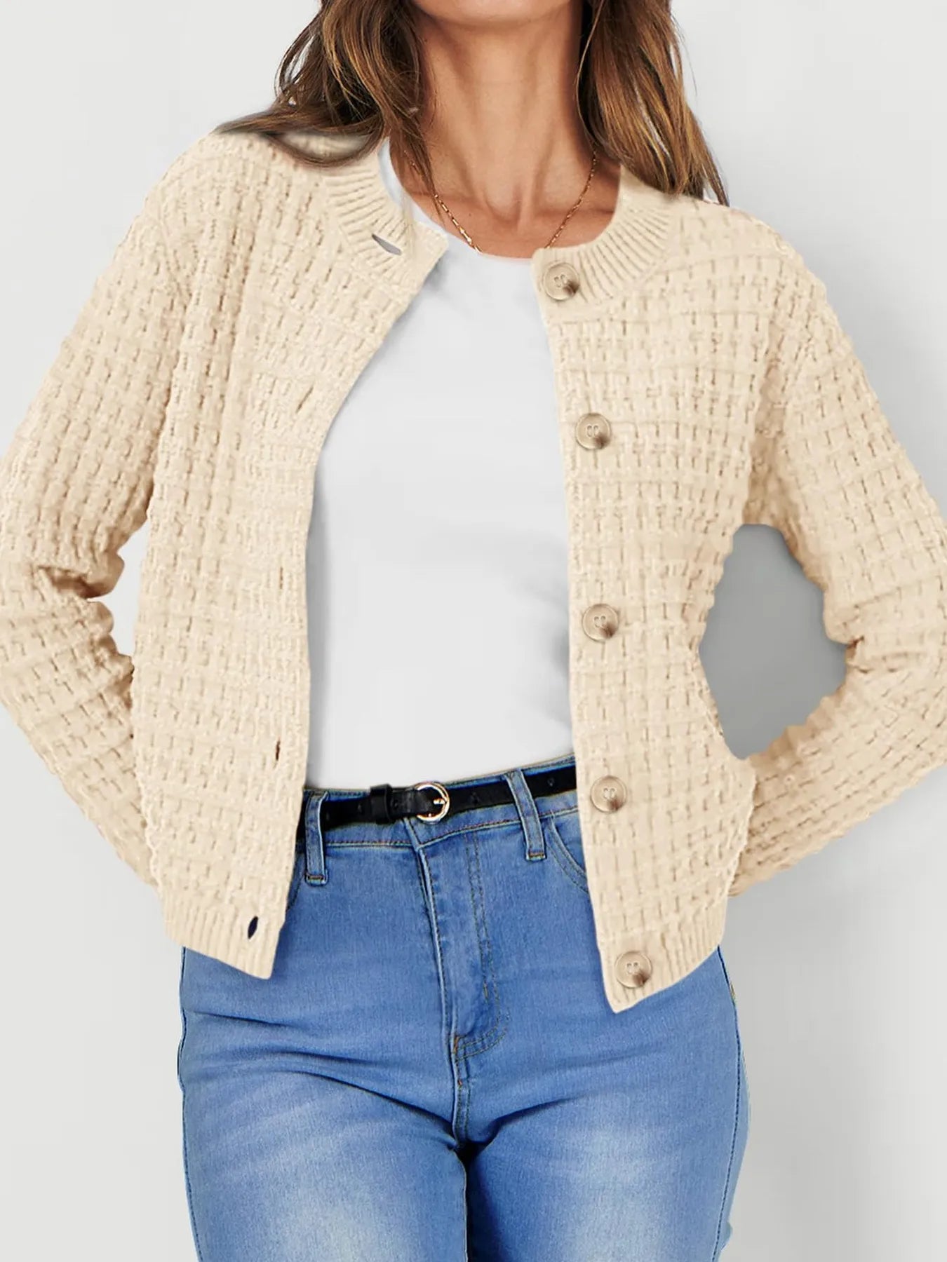 Cream textured knit cardigan with wood-style buttons and long sleeves, front view