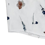 White dress hem with small floral print