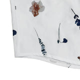 White dress hem with small floral print
