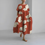 Women's floral dress, rust red base with white cloud-flower print, midi length