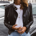 Dark leather moto jacket with zip front, snap collar, and chest zip pocket