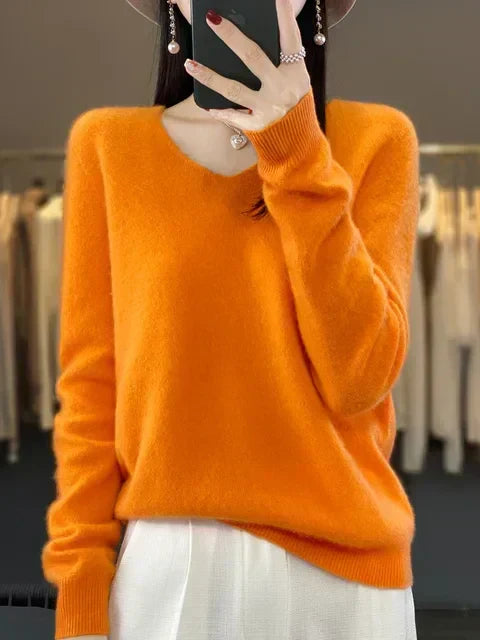 Soft knit sweater in bright orange, long sleeves, crew neckline