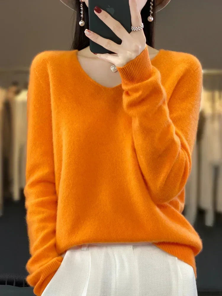 Soft knit pullover sweater in orange, long sleeves, crew neckline