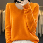 Soft knit pullover sweater in orange, long sleeves, crew neckline