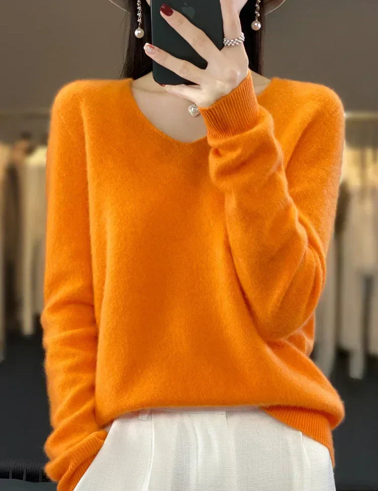Soft knit pullover sweater in orange, long sleeves, crew neckline