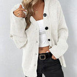 White hooded button-front knit pullover with long sleeves and ribbed cuffs