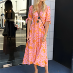 Orange patterned midi dress with V-neck button front and short sleeves