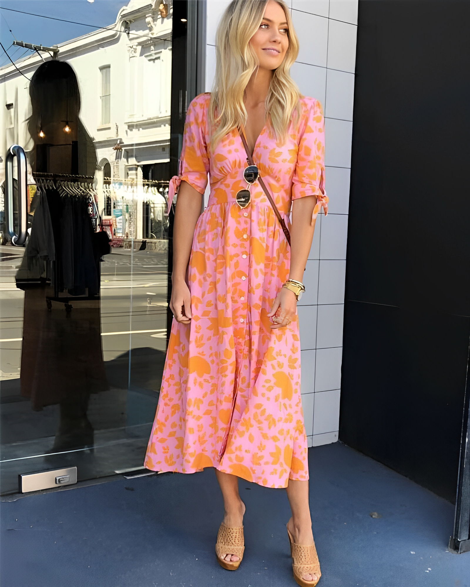 Orange patterned midi dress with V-neck button front and short sleeves
