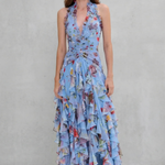 Blue floral halter maxi dress with braided tie waist detail and cascading ruffle tiers