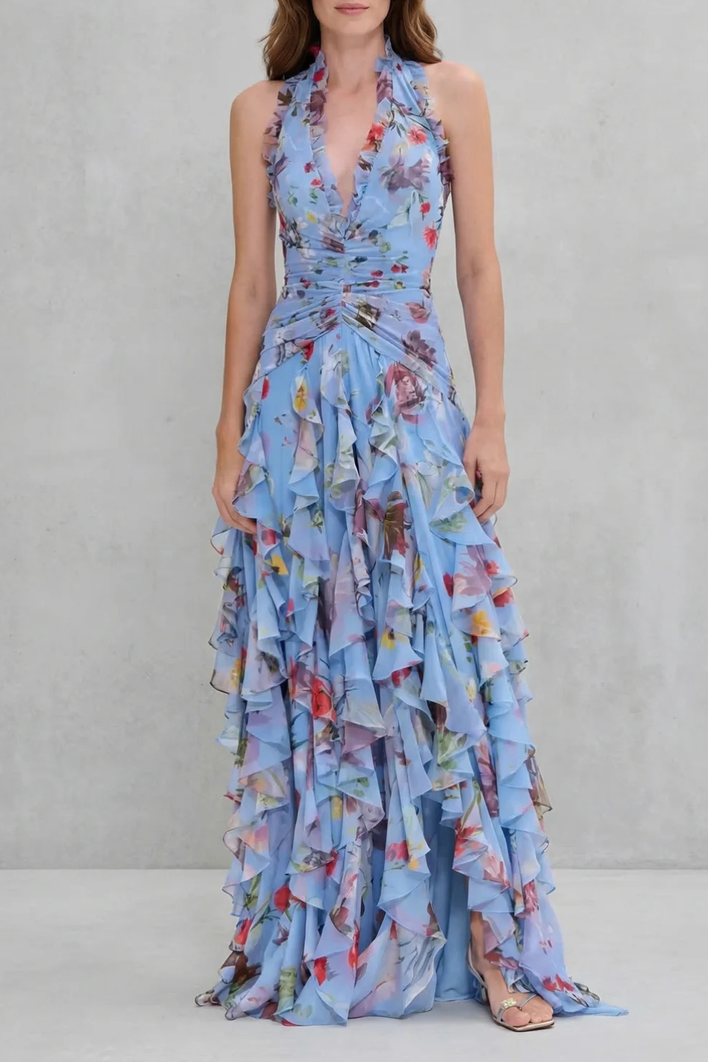 Blue floral halter maxi dress with ruched waist and layered ruffle skirt