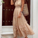 Beige boho maxi dress close-up, lace-trim bodice and tiered tulle skirt