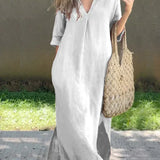White casual shirt dress, V-neck, three-quarter sleeves, relaxed midi length with side slit