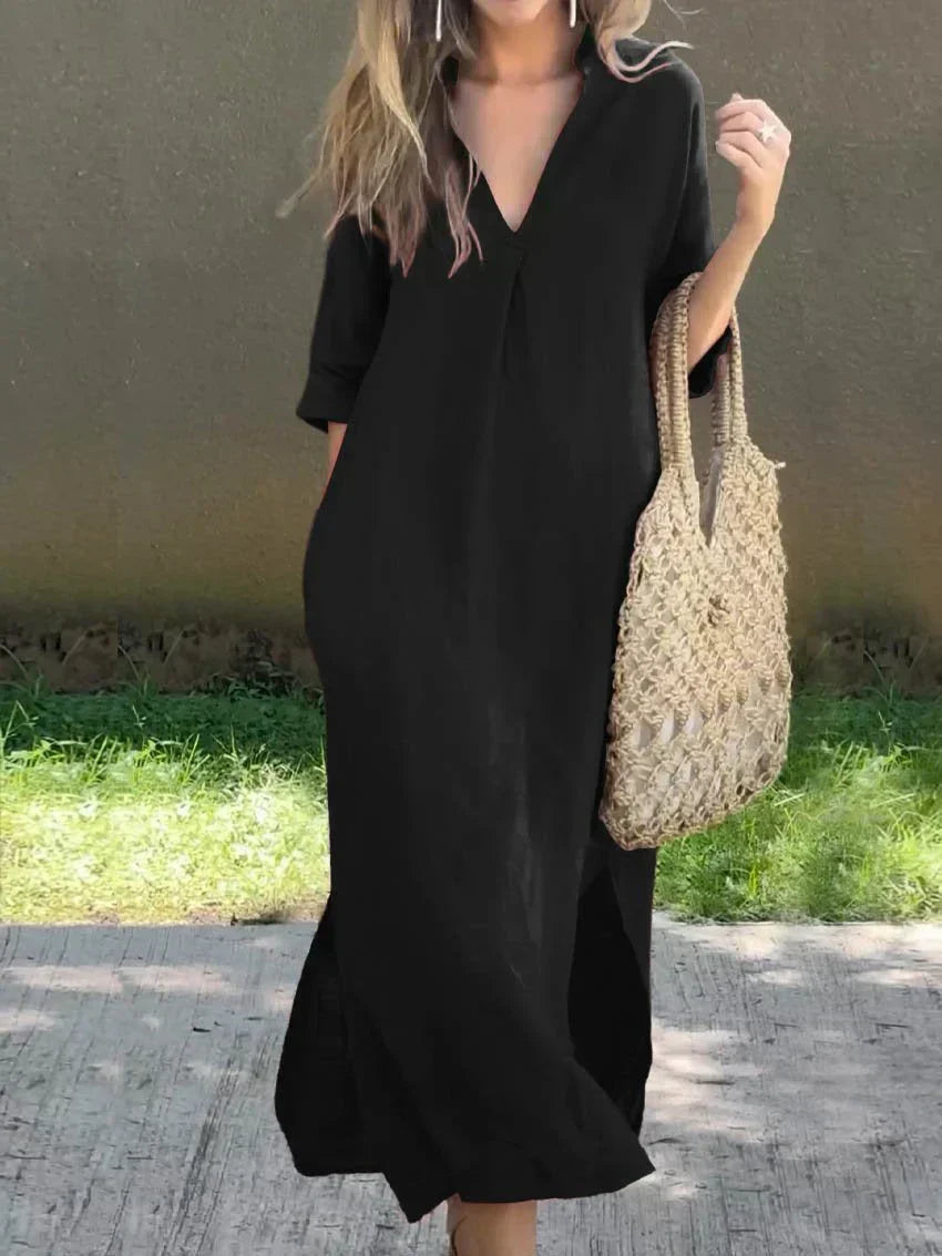 Black casual shirt dress, V-neck, three-quarter sleeves, relaxed midi length with side slit