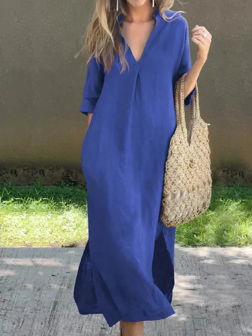 Blue casual shirt dress, V-neck, three-quarter sleeves, relaxed midi length with side slit