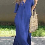 Blue casual shirt dress, V-neck, three-quarter sleeves, relaxed midi length with side slit