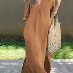 Brown casual shirt dress, V-neck, three-quarter sleeves, relaxed midi length with side slit