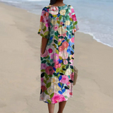Floral midi dress with V-neck and short sleeves, multicolor bloom print