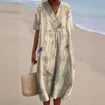 Light beige midi dress with V-neck and short sleeves, botanical print and gathered waist