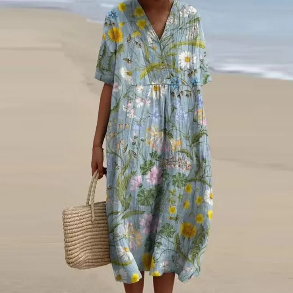 Pale blue floral midi dress with V-neck and short sleeves, button detail and gathered waist