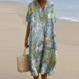Pale blue floral midi dress with V-neck and short sleeves, button detail and gathered waist