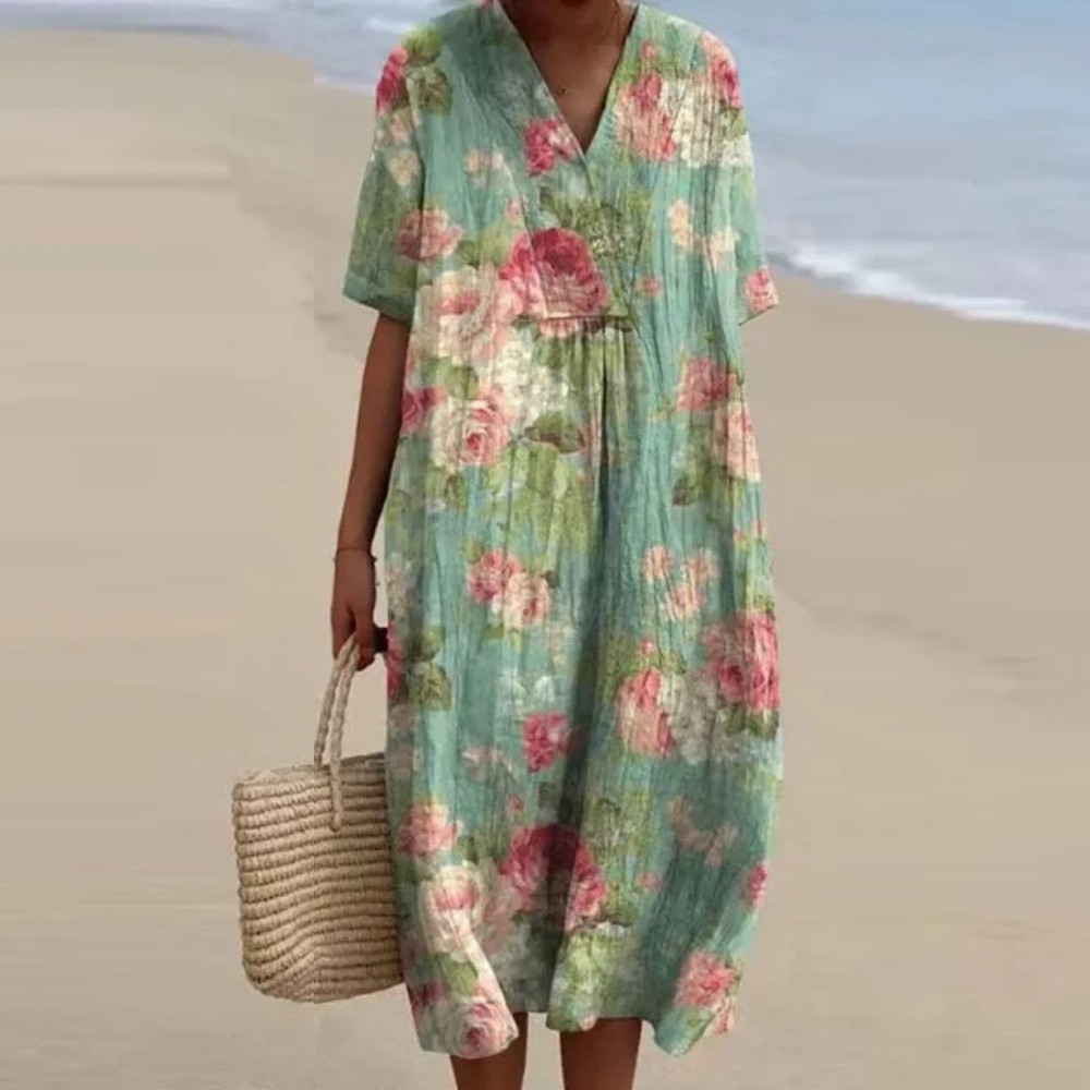 Mint green floral midi dress with V-neck and short sleeves, gathered waist and loose fit