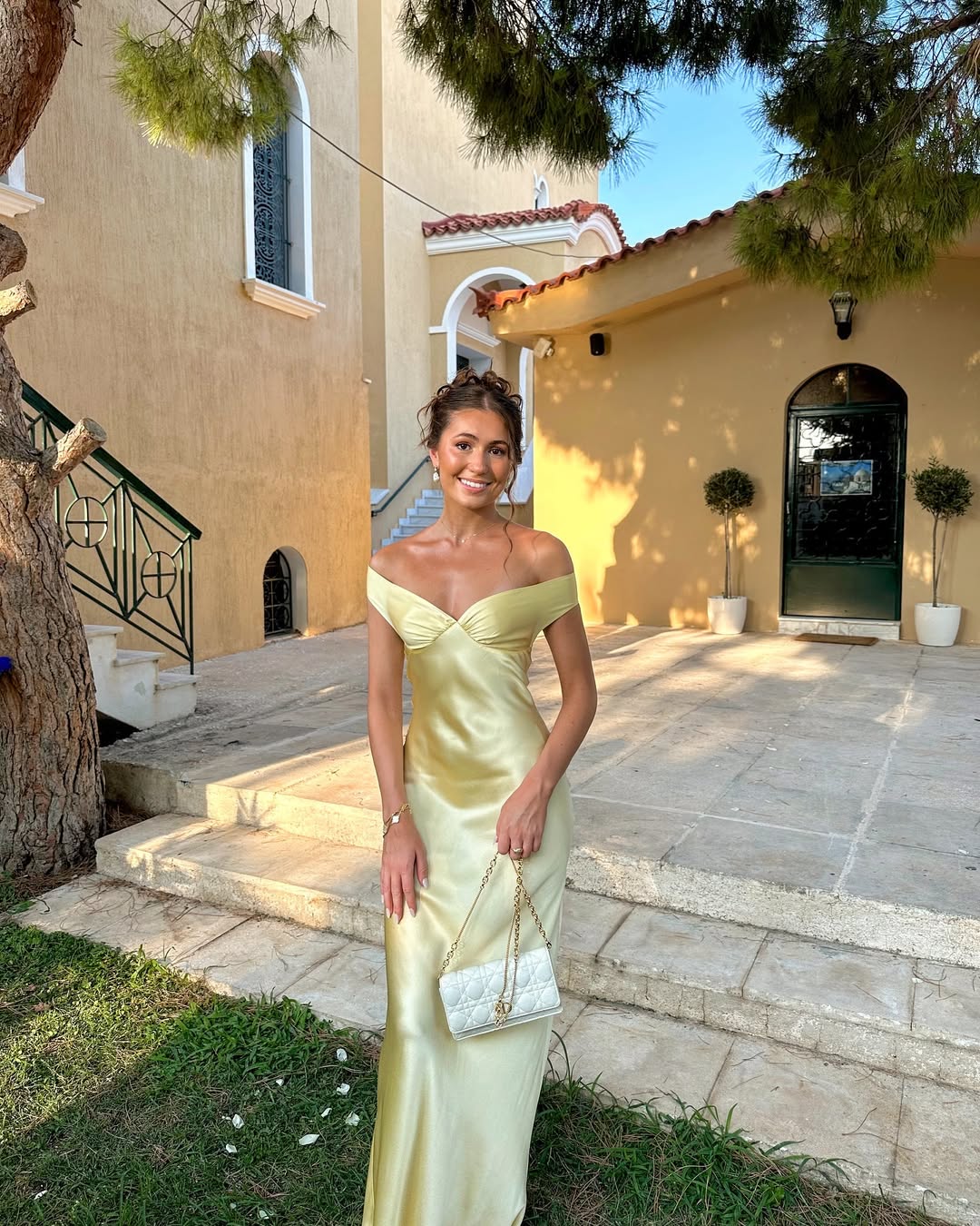 Light gold satin evening dress with strapless sweetheart neckline and draped bodice