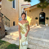 Light gold satin evening dress with strapless sweetheart neckline and draped bodice