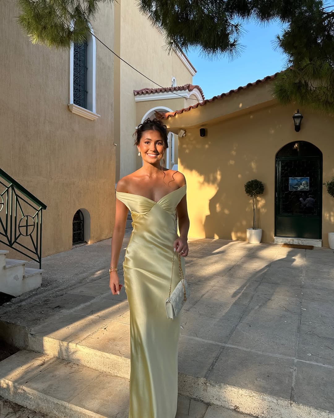 Light gold strapless satin evening dress with sweetheart neckline and floor-length column skirt