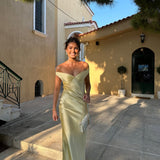 Light gold strapless satin evening dress with sweetheart neckline and floor-length column skirt