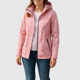 Pink hooded jacket worn with jeans, front zipper and leaf-patterned fabric visible
