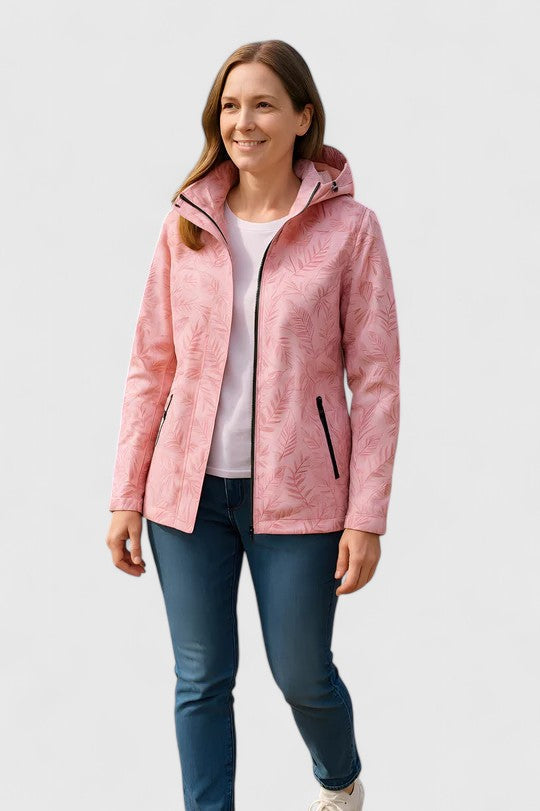 Pink hooded jacket worn with jeans, front zipper and leaf-patterned fabric visible