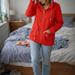 Red hooded rain jacket with long sleeves, zip front, and front pockets