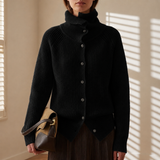 Black long-sleeve cardigan with button front, ribbed turtleneck collar, asymmetric hem