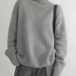 Gray roll-neck sweater with ribbed turtleneck and cuffed long sleeves