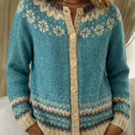 Blue knit cardigan with button-front, fair-isle yoke, and long sleeves