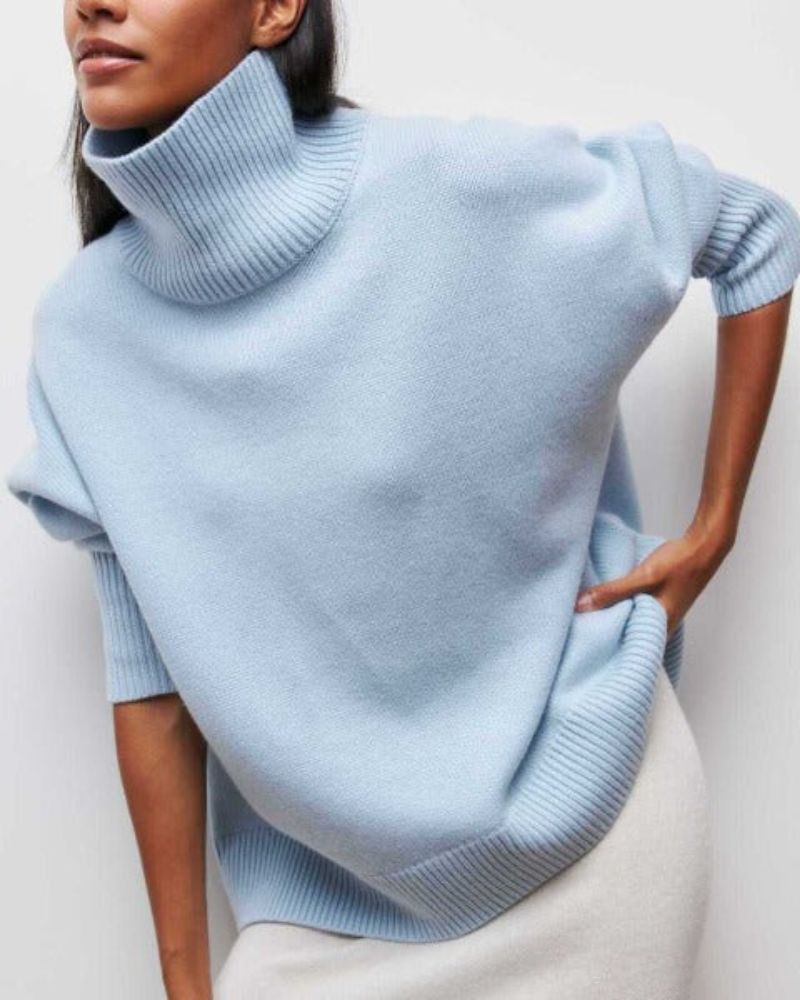 Light blue turtleneck sweater with ribbed collar and cuffs