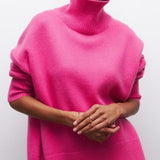 Pink turtleneck sweater with thick rib-knit collar and relaxed fit