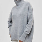 Heather gray turtleneck sweater with ribbed cuffs and high neckline