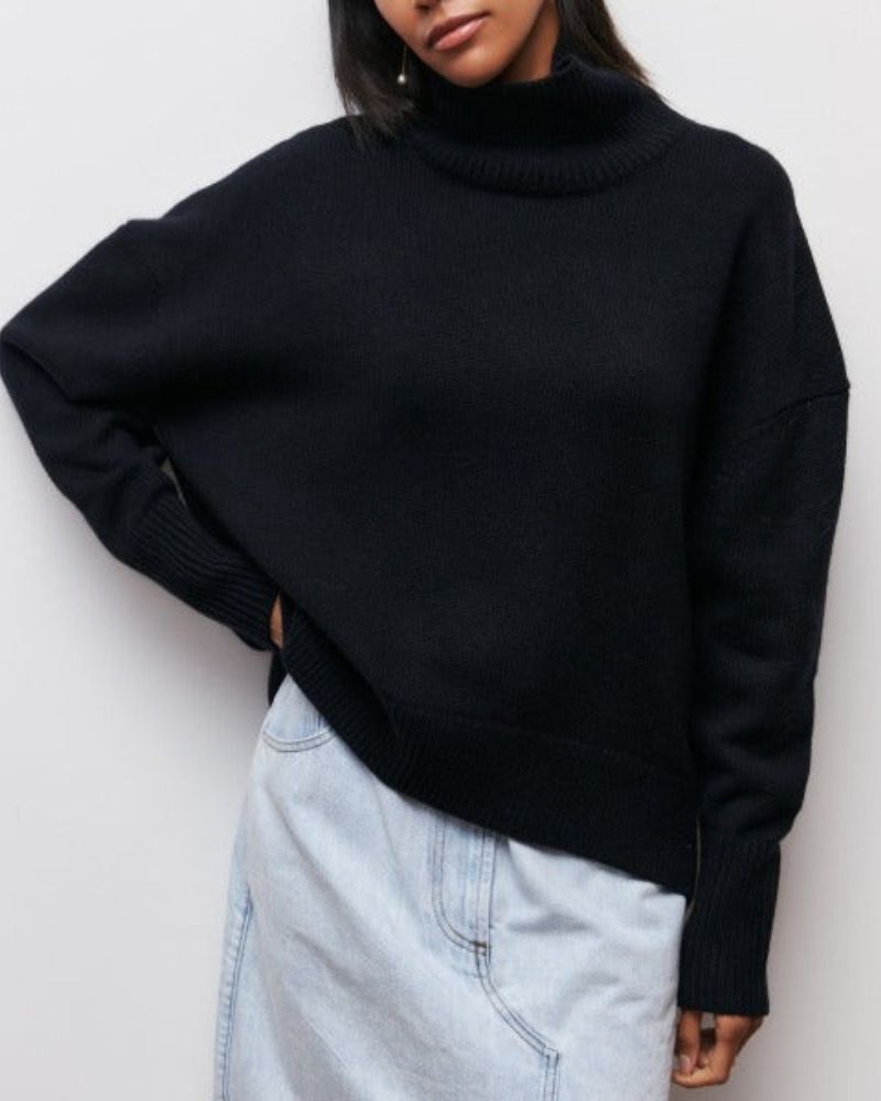 Black turtleneck sweater with ribbed collar and long sleeves