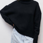 Black turtleneck sweater with ribbed collar and long sleeves