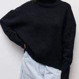 Black turtleneck sweater with ribbed collar and long sleeves