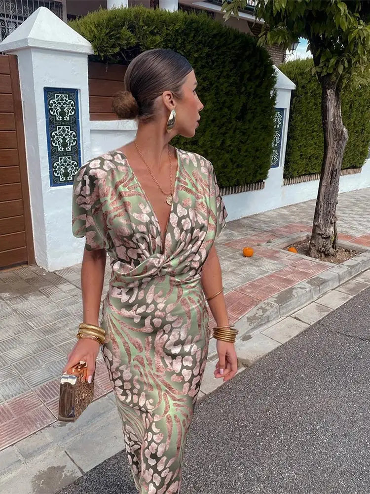 Midi wrap dress in light green and pink abstract print, V-neck and short flutter sleeves