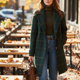 Women’s dark green plaid long coat with lapels and button front, worn with jeans