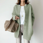 Green layered button-front cardigan with long sleeves and open front