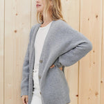 Cozy knit button-front cardigan in light heather gray with V-neck and long sleeves