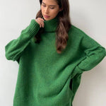 Green knit turtleneck sweater with chunky ribbed collar and long sleeves
