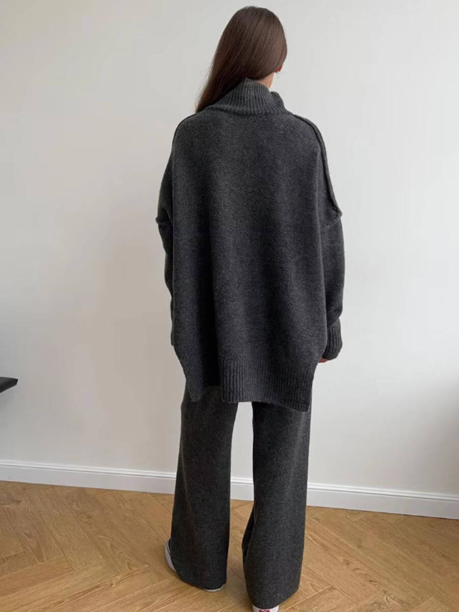 Dark gray knit turtleneck sweater and wide-leg pants set, back view showing collar