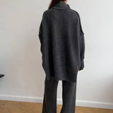 Dark gray knit turtleneck sweater and wide-leg pants set, back view showing collar