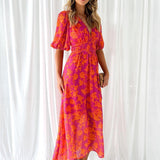 Pink-orange floral midi dress, short puff sleeves, gathered waist, front view