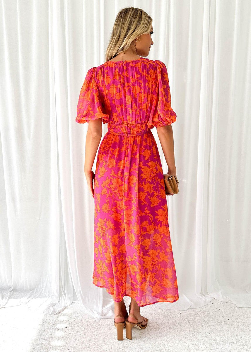 Pink-orange floral midi dress with puff sleeves and back tie detail, back view